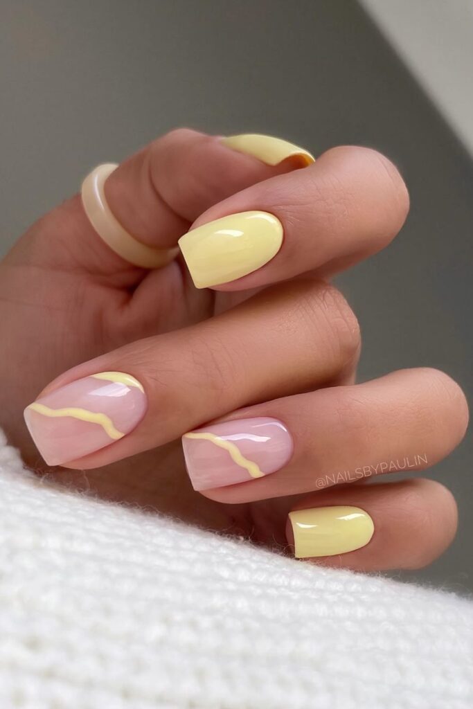 Butter yellow mani with swirl art