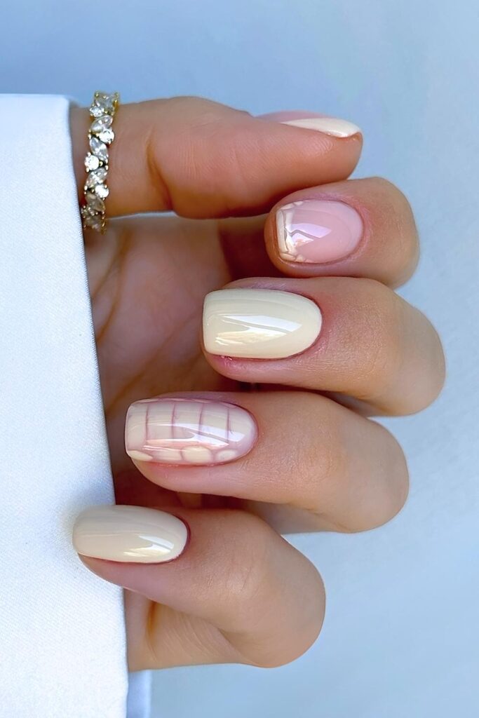 Short butter yellow nails with animal print