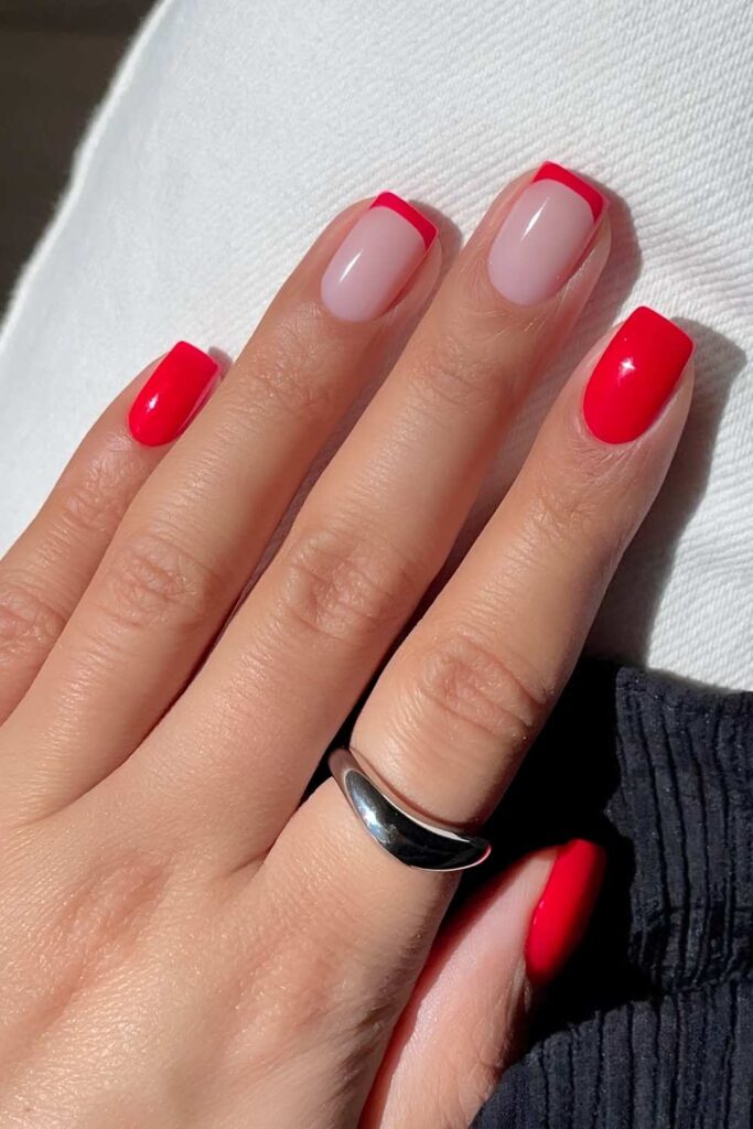 Bright red nails with French tip accents