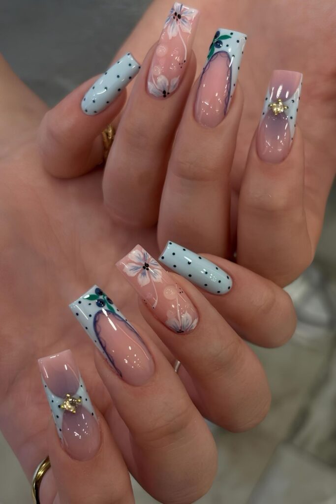 Light blue nails with mismatched designs
