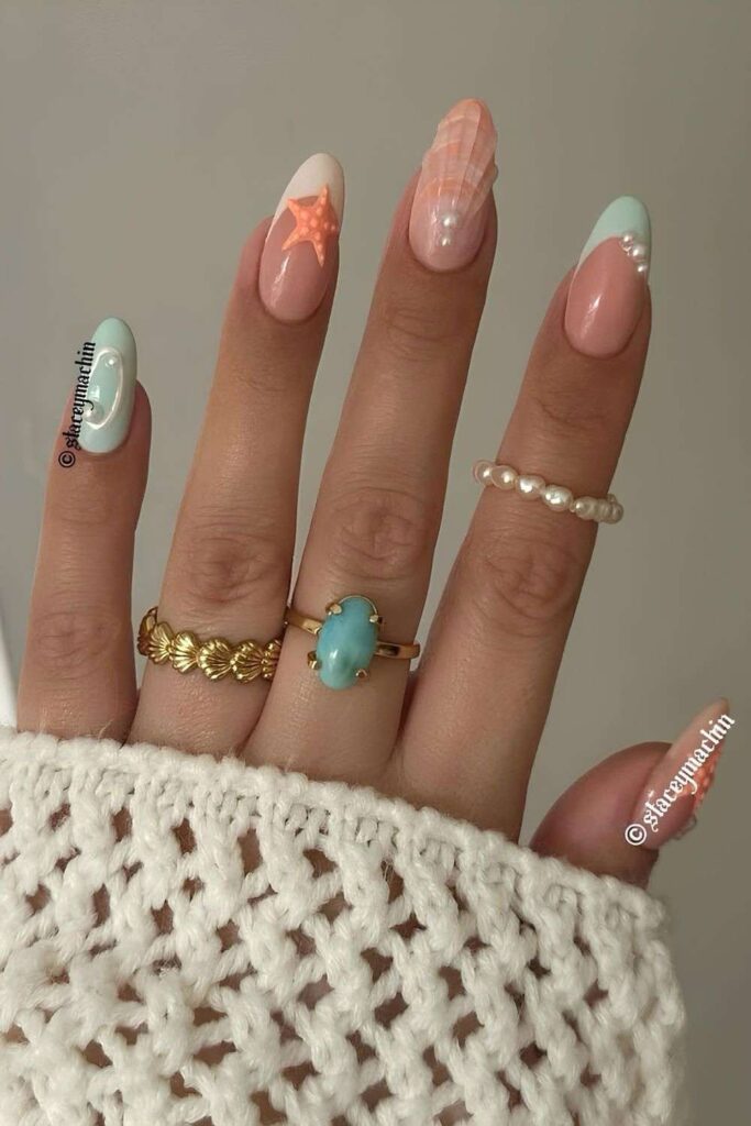 Mint and orange seashell nails