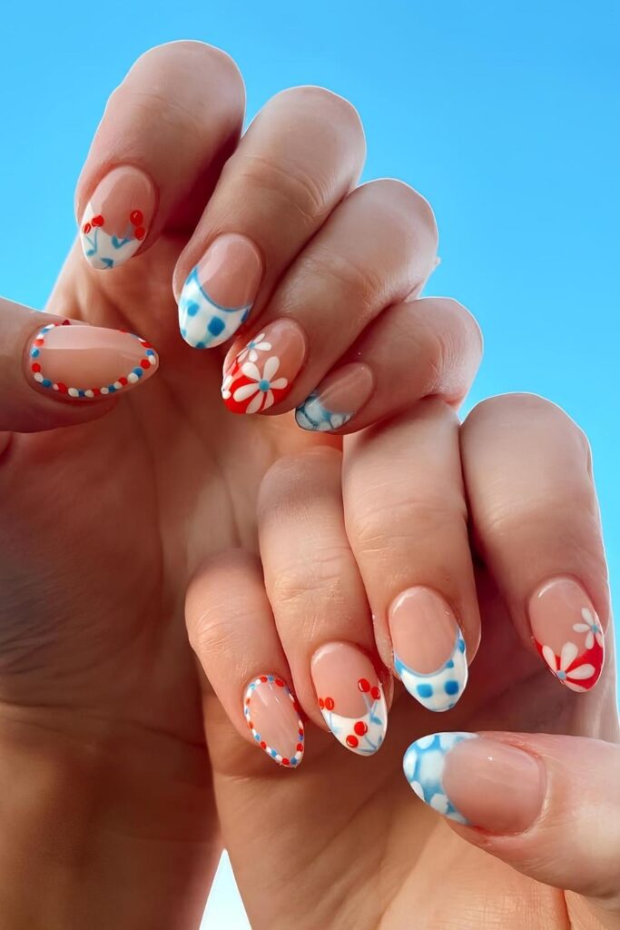Red, blue and white nails with mixed designs