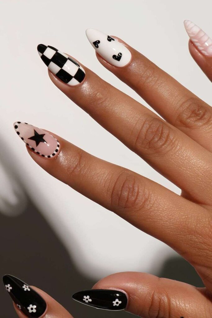 Black and white nails with mismatched design