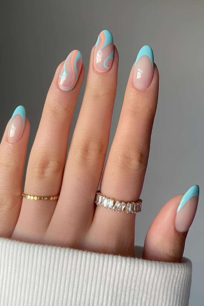 Blue and orange French nails with swirls