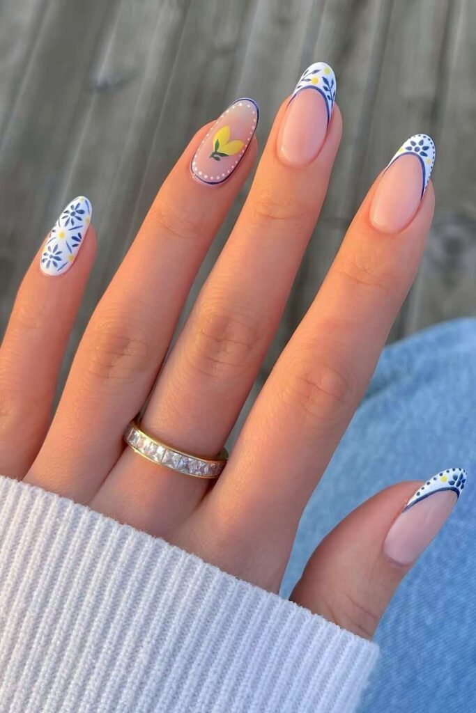 Blue and white French nails with lemon accents and florals