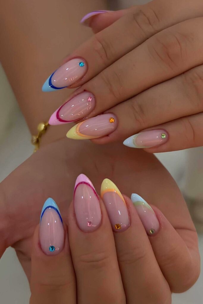 Colorful French nails with outlines and rhinestones