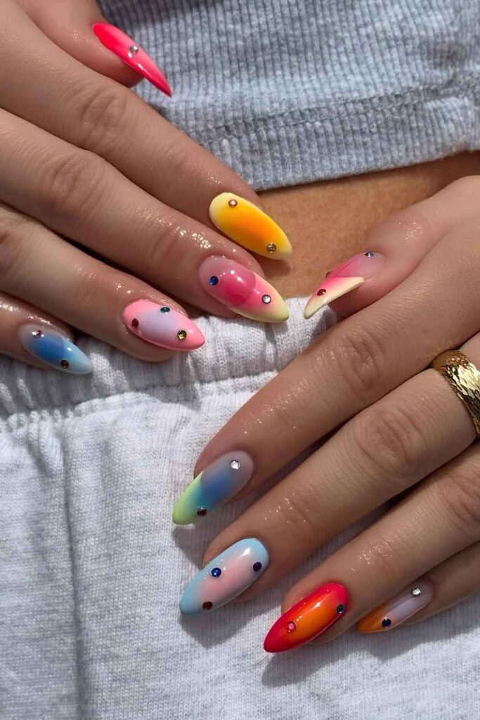 Colorful nails with aura effect and rhinestones