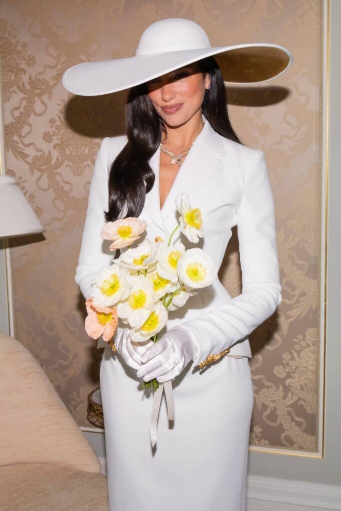 Dua Lipa Schiaparelli civil wedding look with statement bridal hat