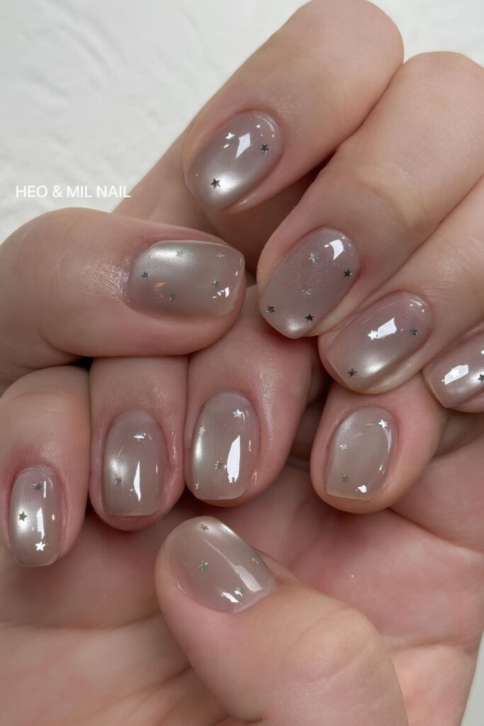 Jelly gray nails with silver stars