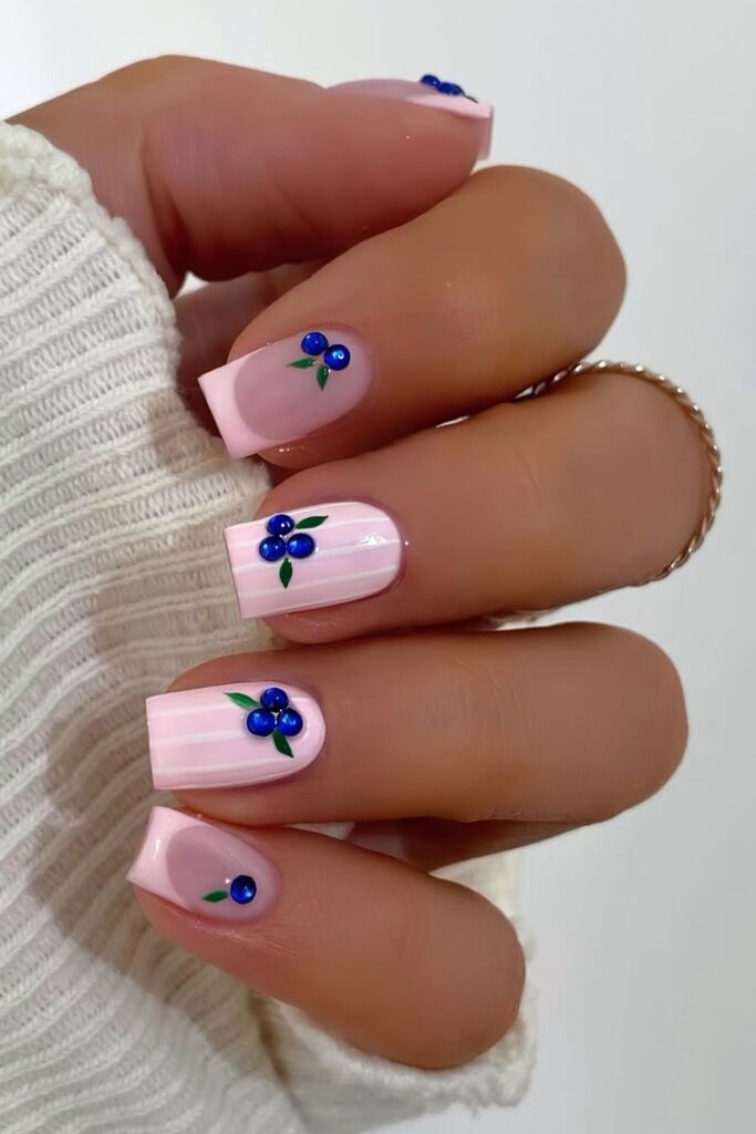 Light pink nails with 3d blueberries and stripes