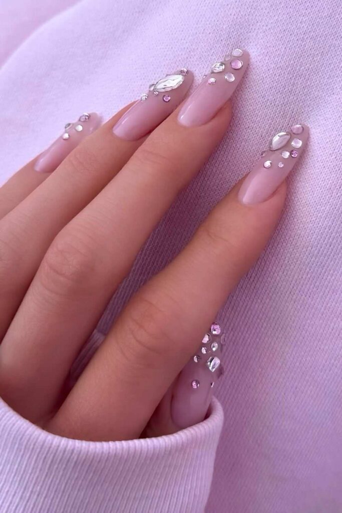 Light pink nails with crystal accents