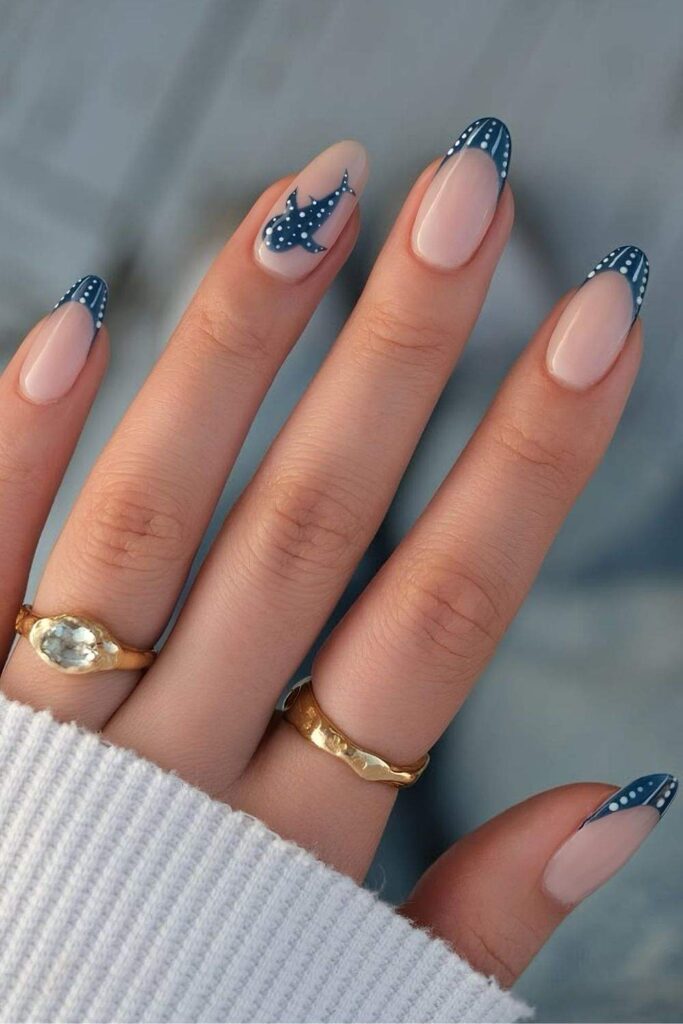 Navy blue dotted French tips with shark accent