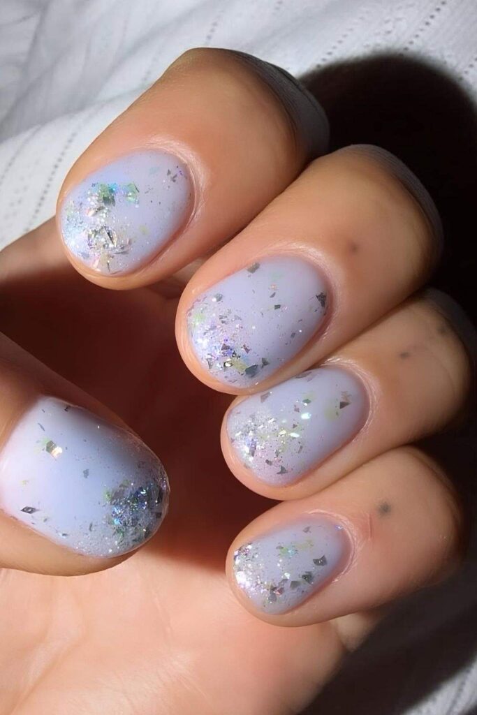 Pastel periwinkle nails with glitter
