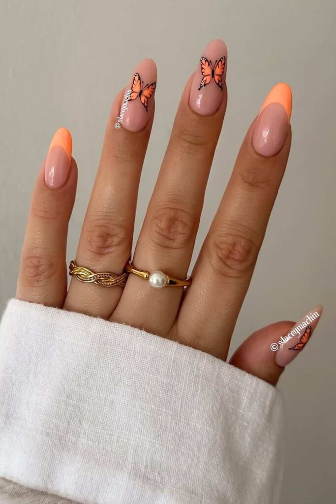 Peachy French nails with butterflies