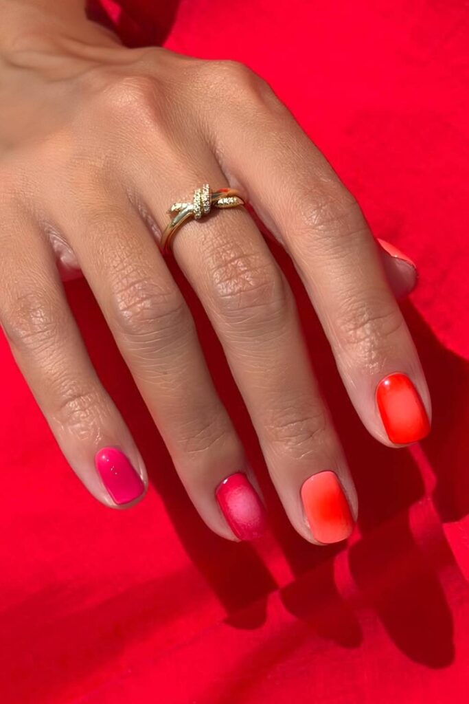 Pink and orange nails with aura effect