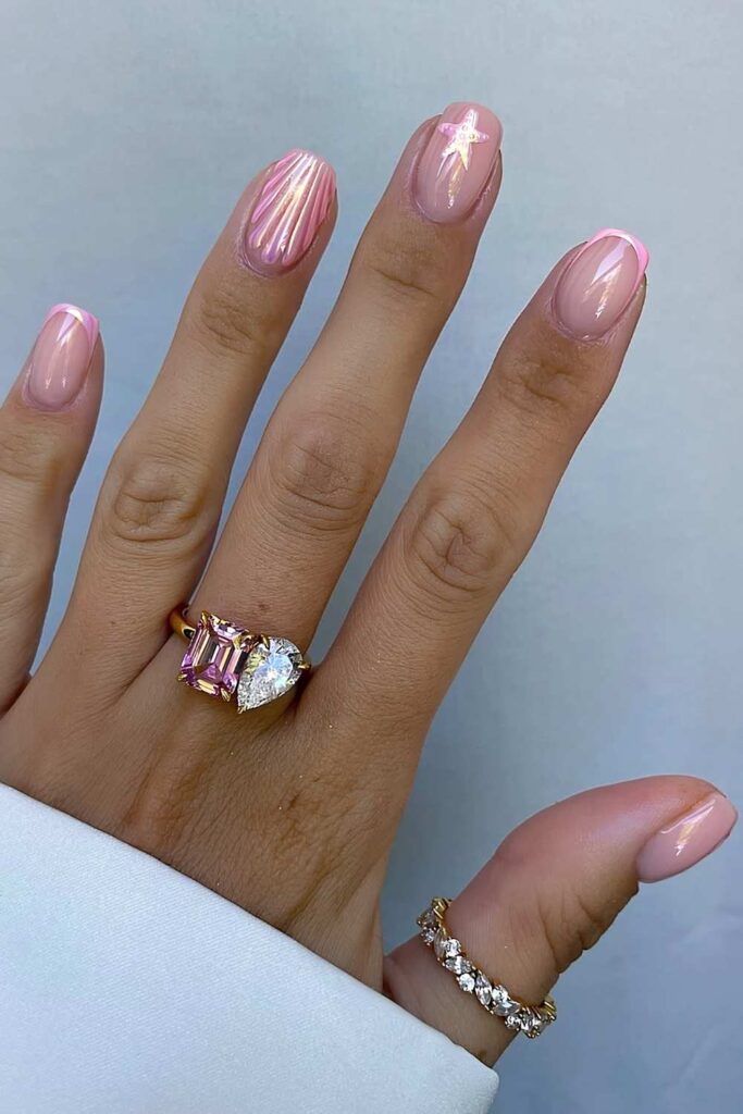Pink chrome nails with seashell design