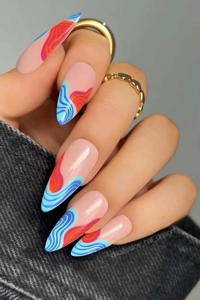 Red, blue and white swirly French nails
