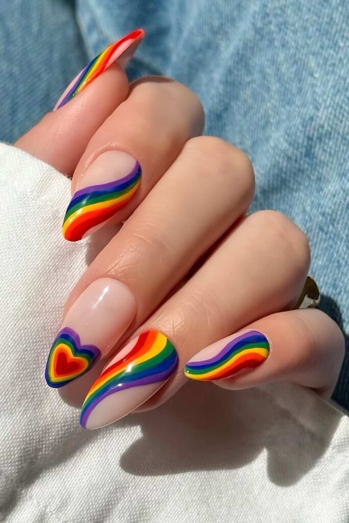 Swirly nails in pride colors and heart accent