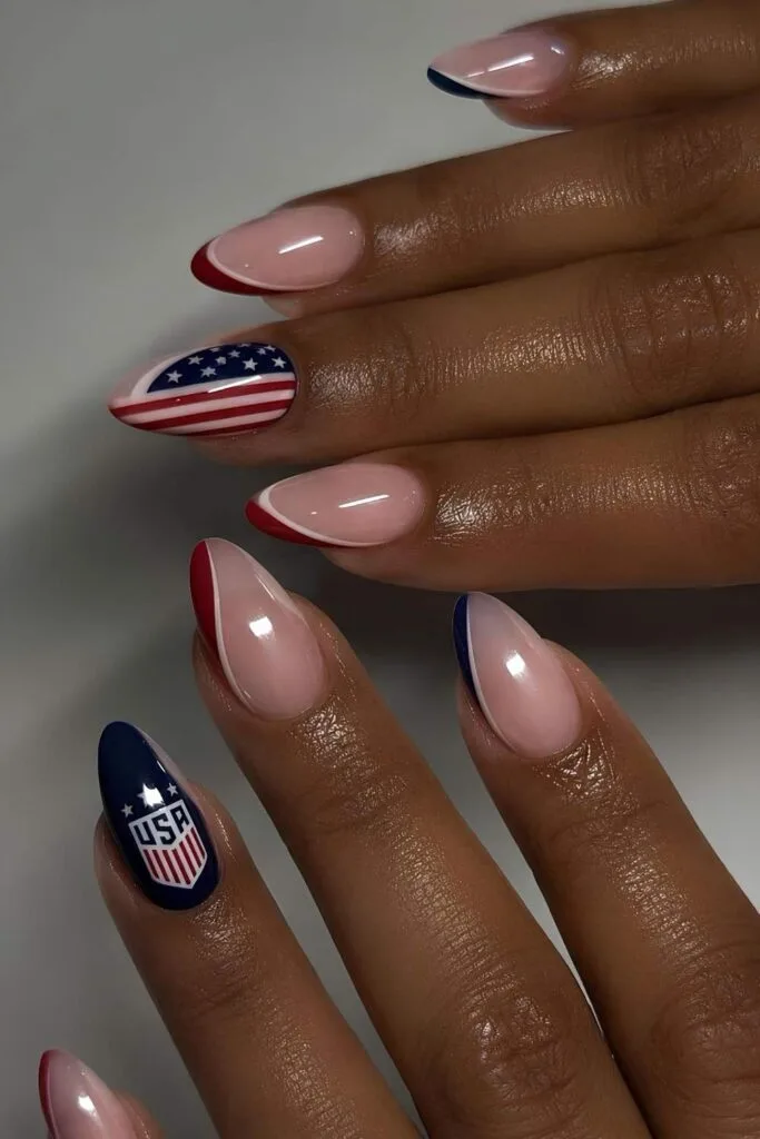 USA World Cup nails with milky pink base and red, white, and blue details