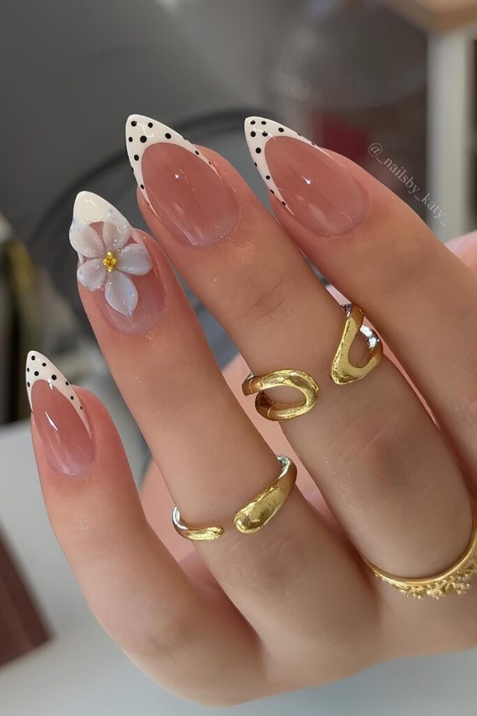 White French nails with black dots and 3d flwer