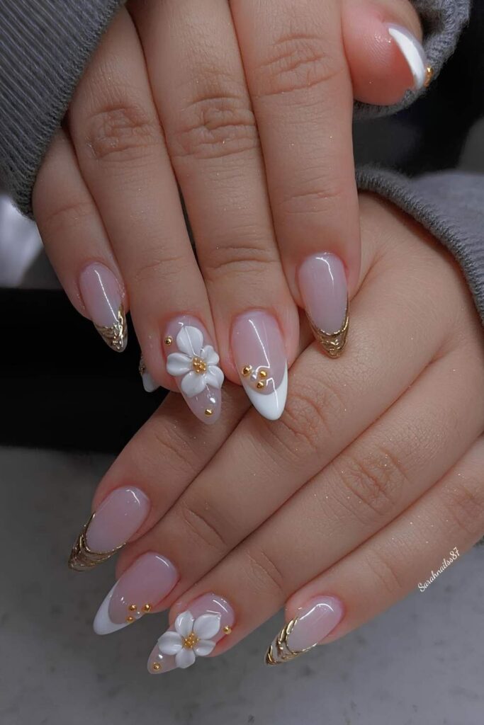 White and gold French nails with 3d flower