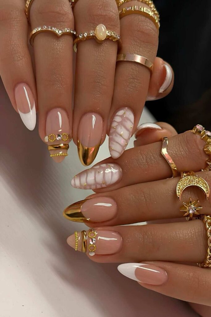 White and gold nails with metallic details