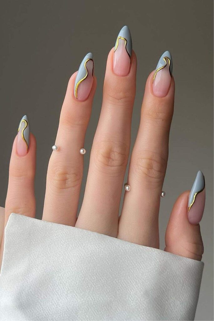 Baby blue French nails with gold outlines