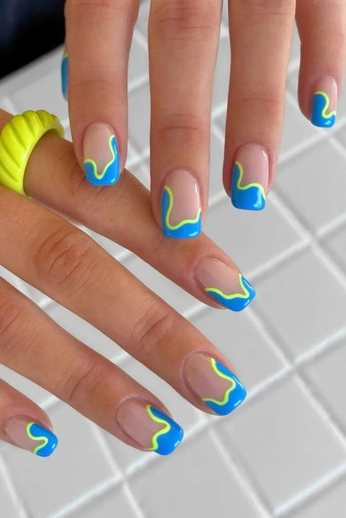Blue abstract French nails with neon yellow outline