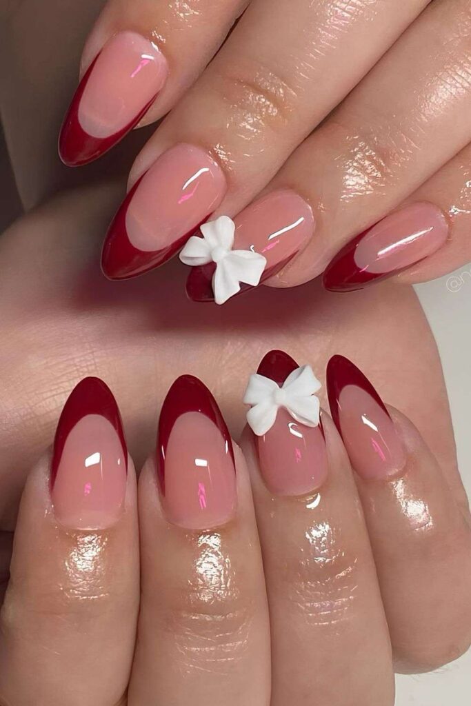 Cherry red French nails with white 3d bow