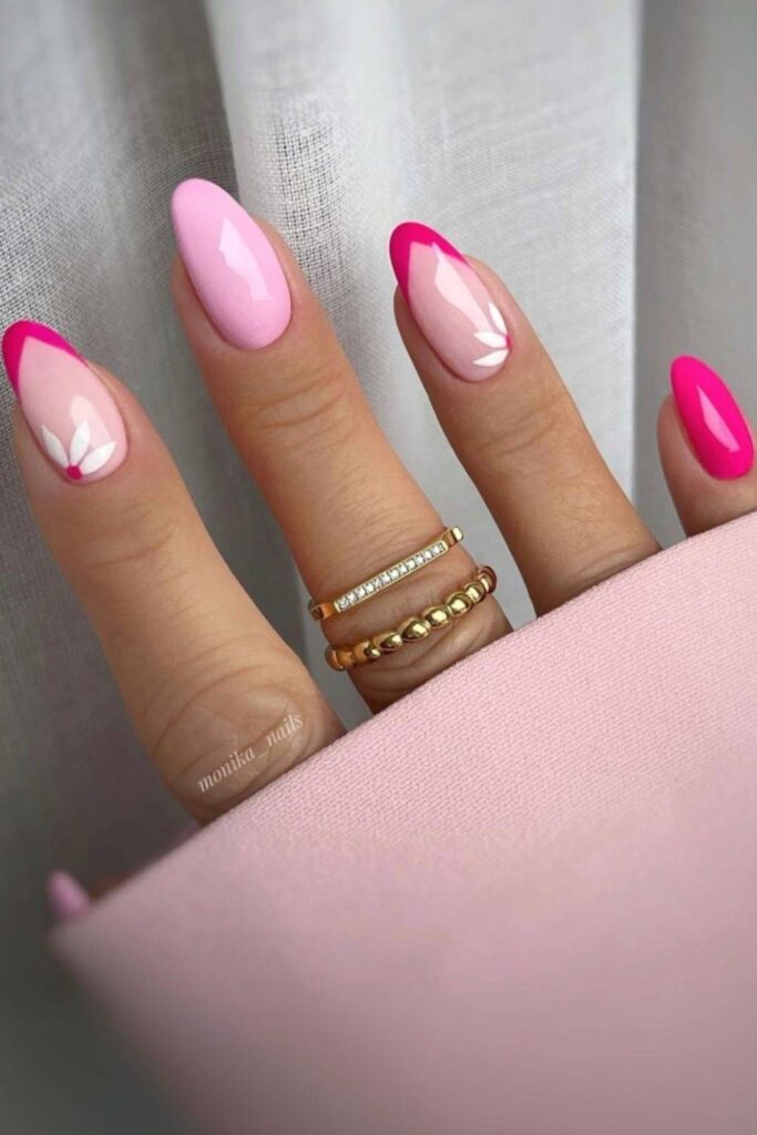 Hot pink French nails with baby pink accent and floral petas