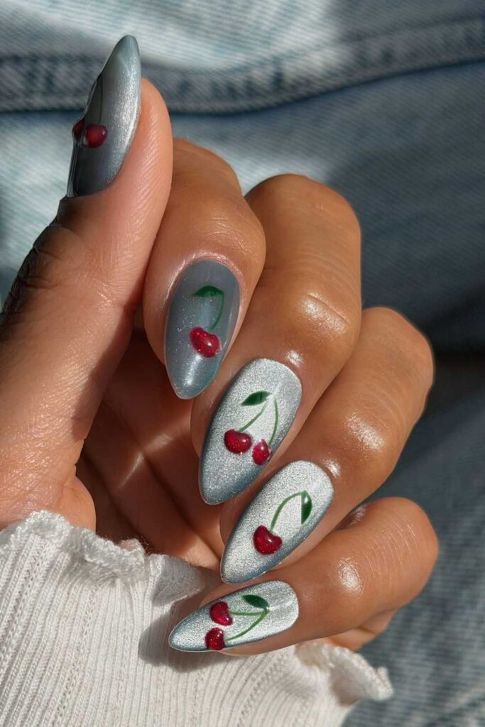 Icy blue velvet nails with cherry accents