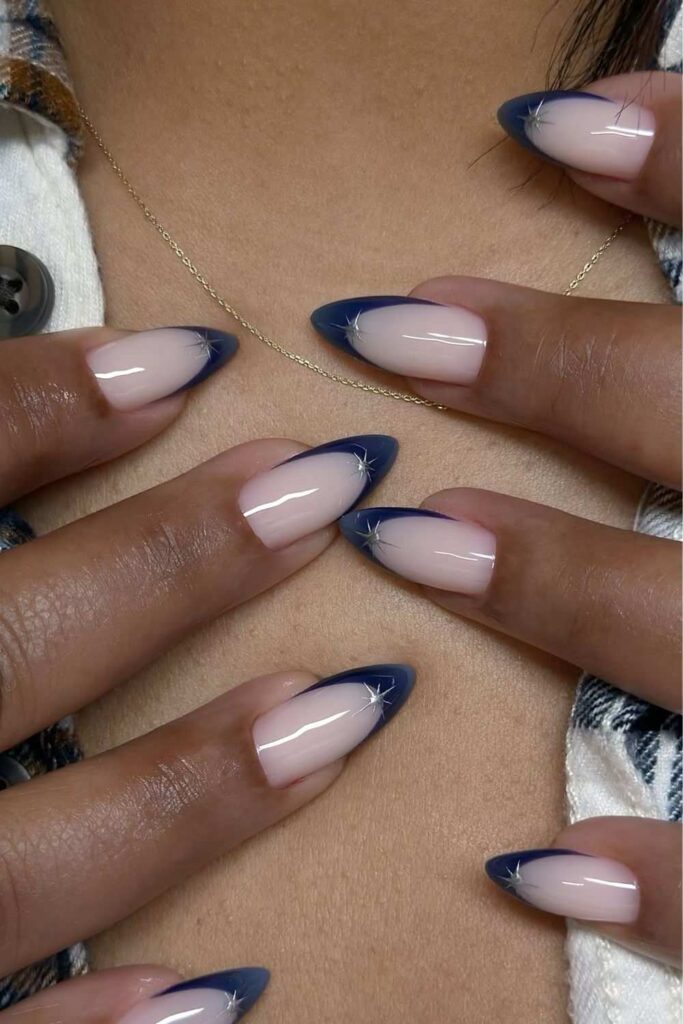 Navy blue French nails with silver stars