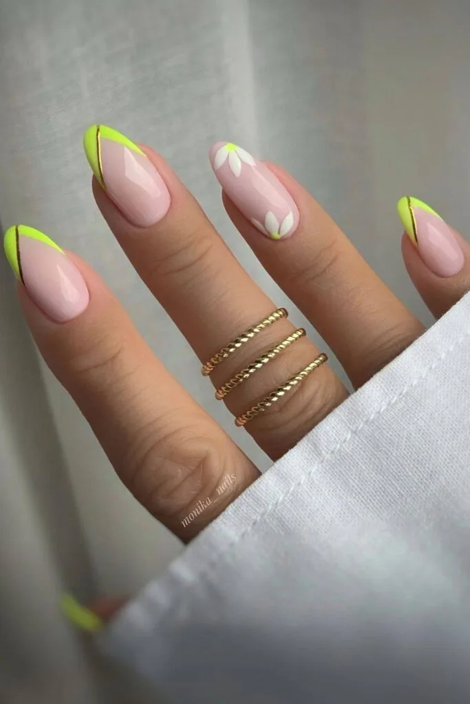 Neon lime French tip nails with flowers and gold lines