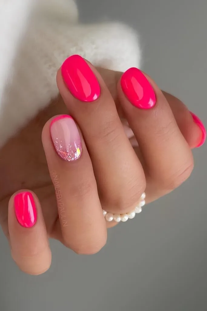 Neon pink nails with glitter and French tip
