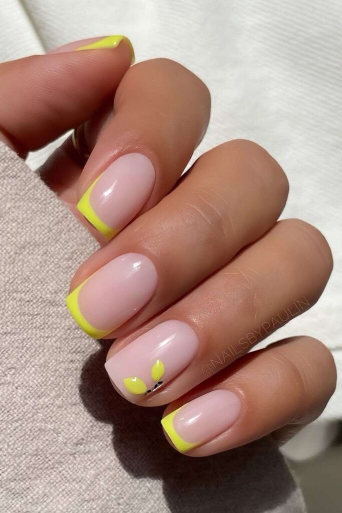 Neon yellow French nails with lemon accent