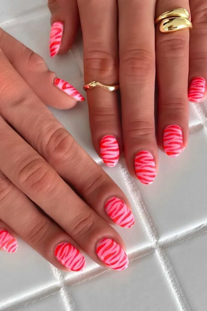 Neon zebra nails in pink and red
