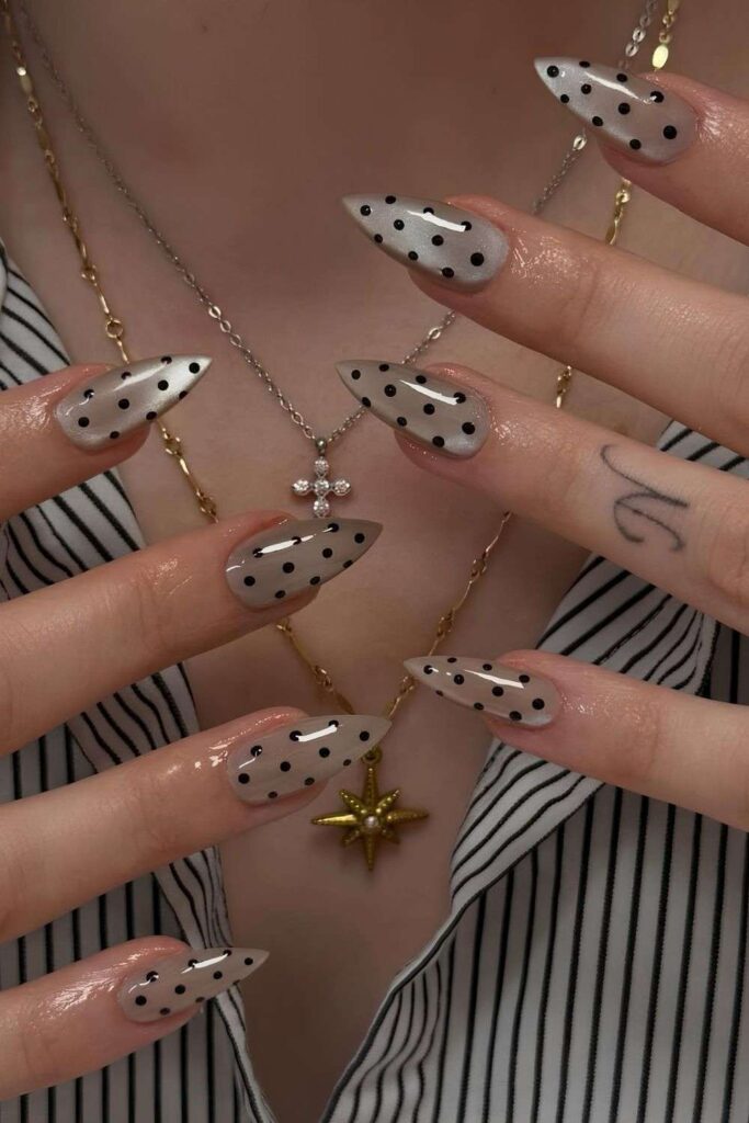 Neutral velvet nails with black dots