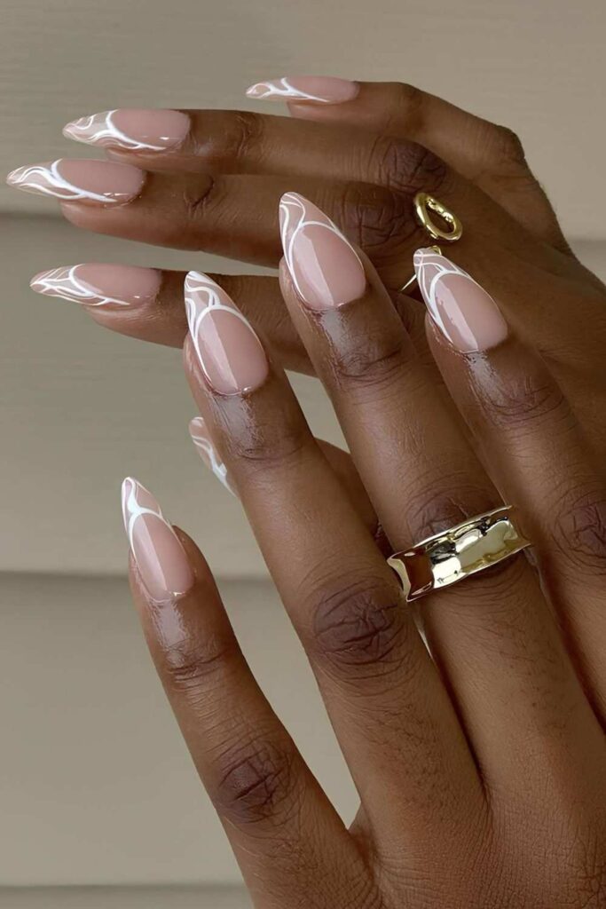 Swirly white French nails