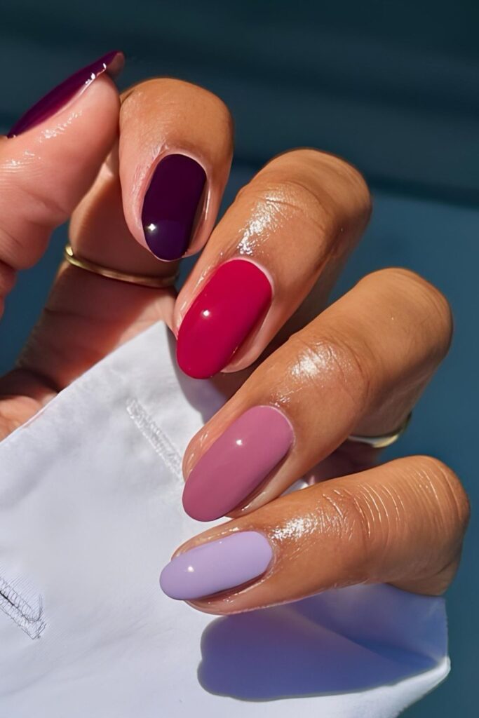 Colorful skittle mani in lavender, pink, red, purple and mauve