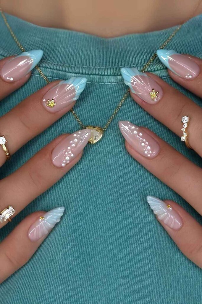 Light blue nails with mermaid core design
