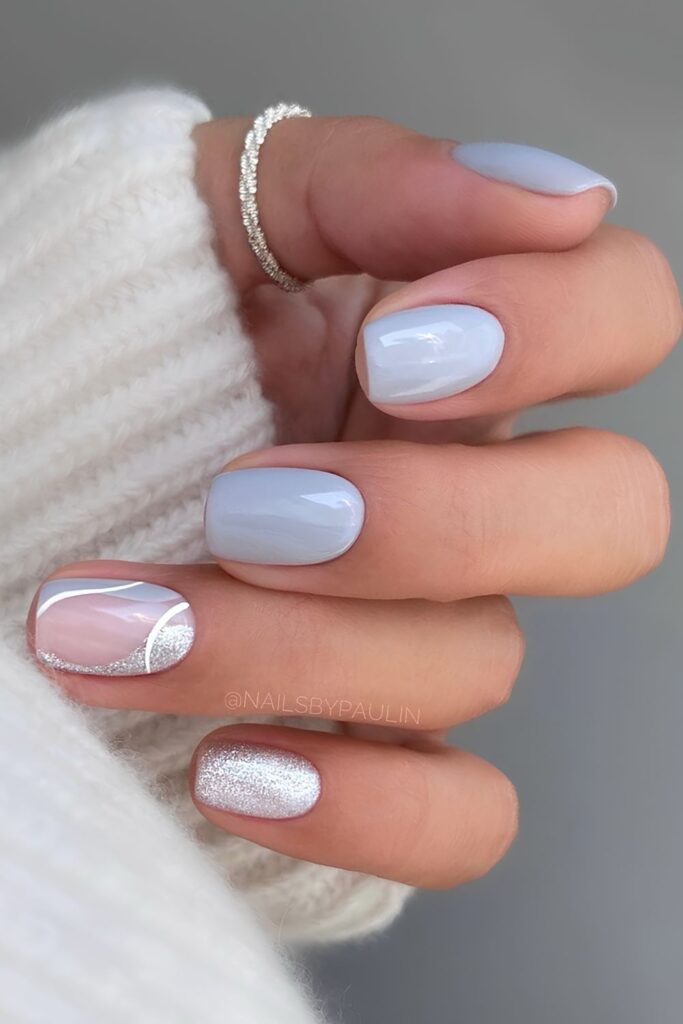 Light gray nails with silver shimmer accents