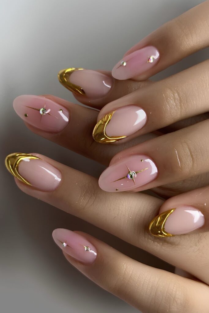 Milky pink nails with gold metal French nails with drip effect and tiny crystals