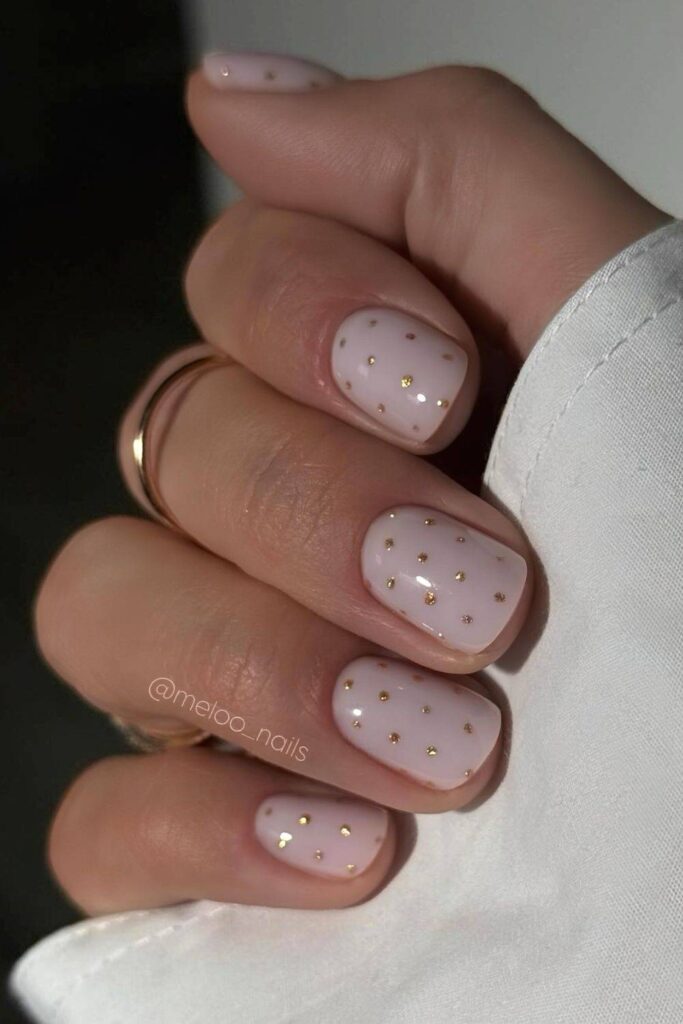 Milky white short mani with gold dots
