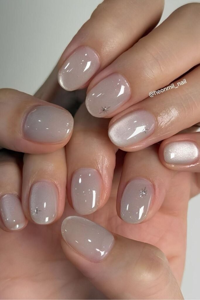 Oyster gray jelly nails with tiny silver stars