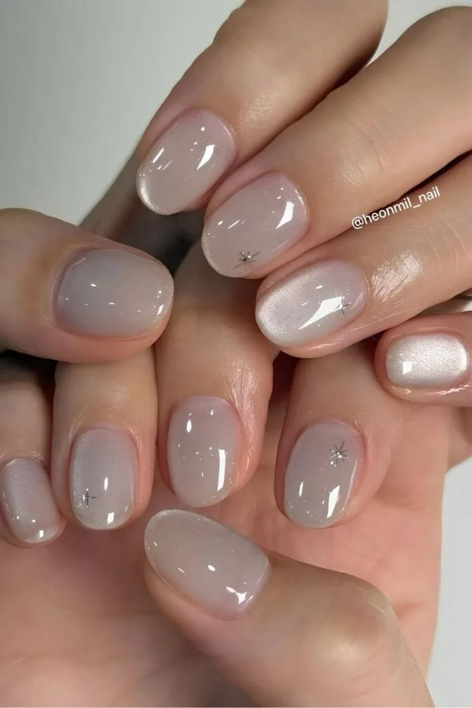 Oyster gray jelly nails with tiny silver stars