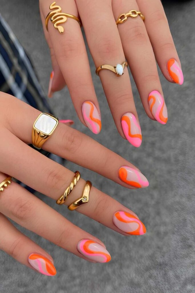 Pink and orange swirly nails