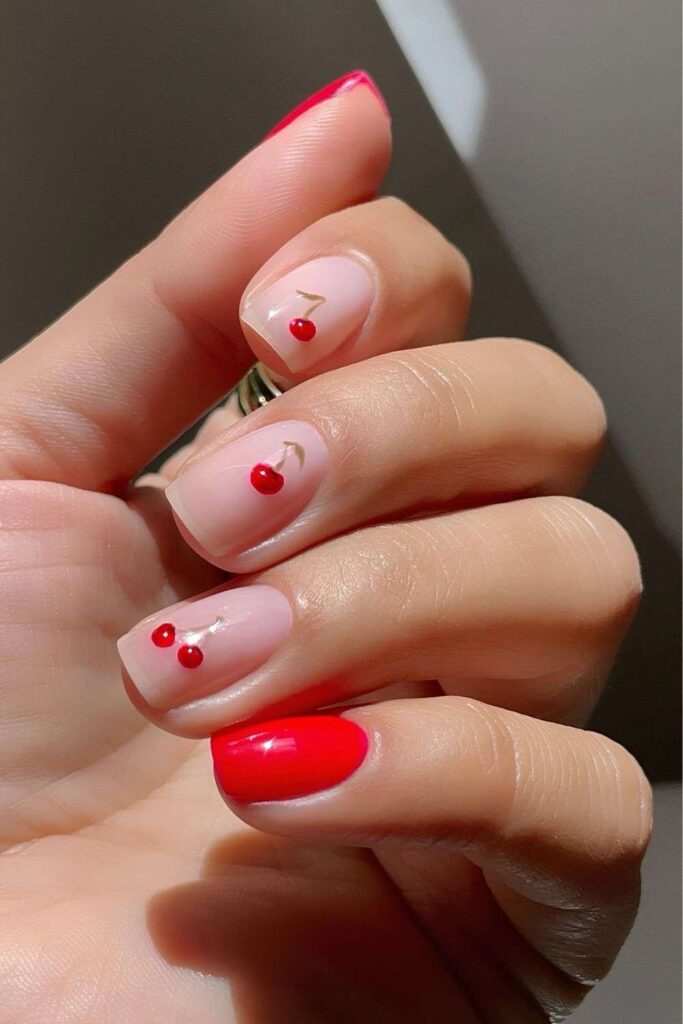 Red and neutral nails with cherries