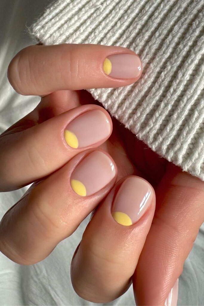 Short milky nails with yellow half moons
