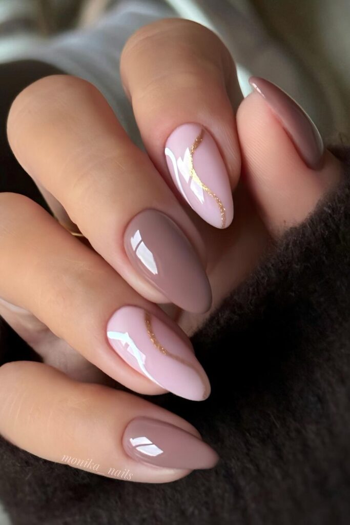 Soft pink and mocha nails with gold swirls