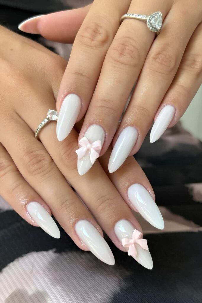 White nails with 3d blush pink bows